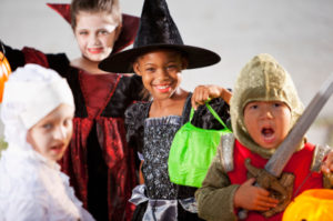 A group of children dressed up for halloween.