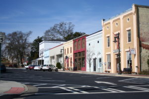 A street with many different buildings on the side.