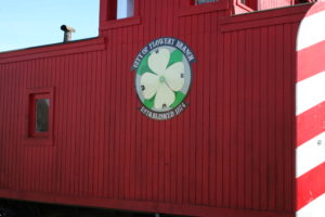 A red building with a sign on it