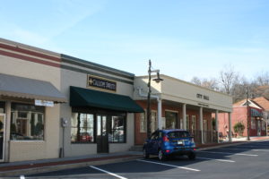 A car parked in front of a store.