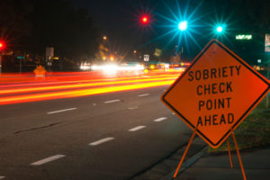 A sign warning drivers to check their speed ahead.