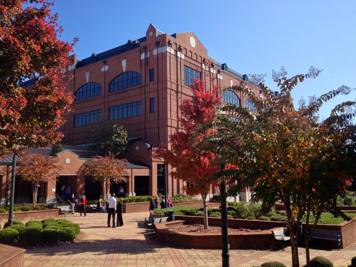 A building with people walking around in the center of it.