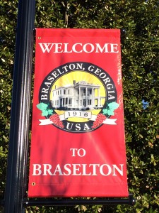 A red banner that says welcome to braselton.